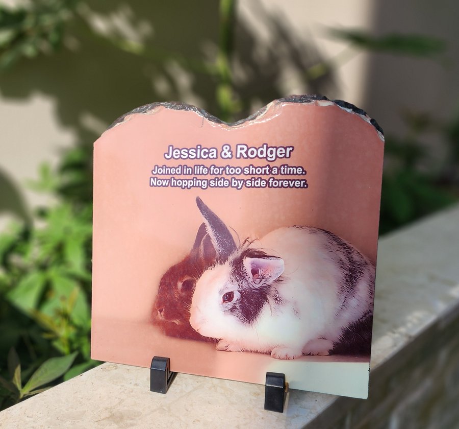 Personalised rabbit memorial stone on a balcony ledge